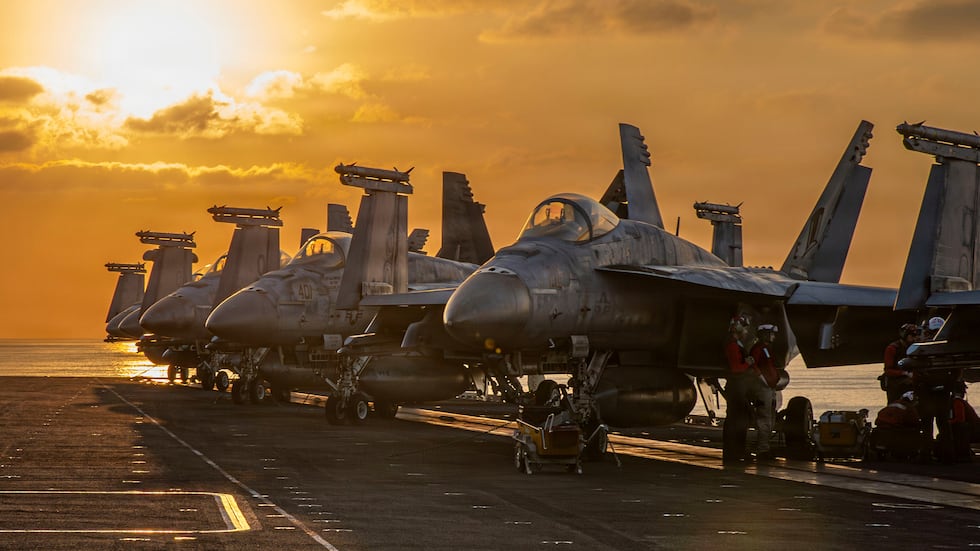 This image provided by U.S. Central Command shows aircraft on the flight deck of the USS...