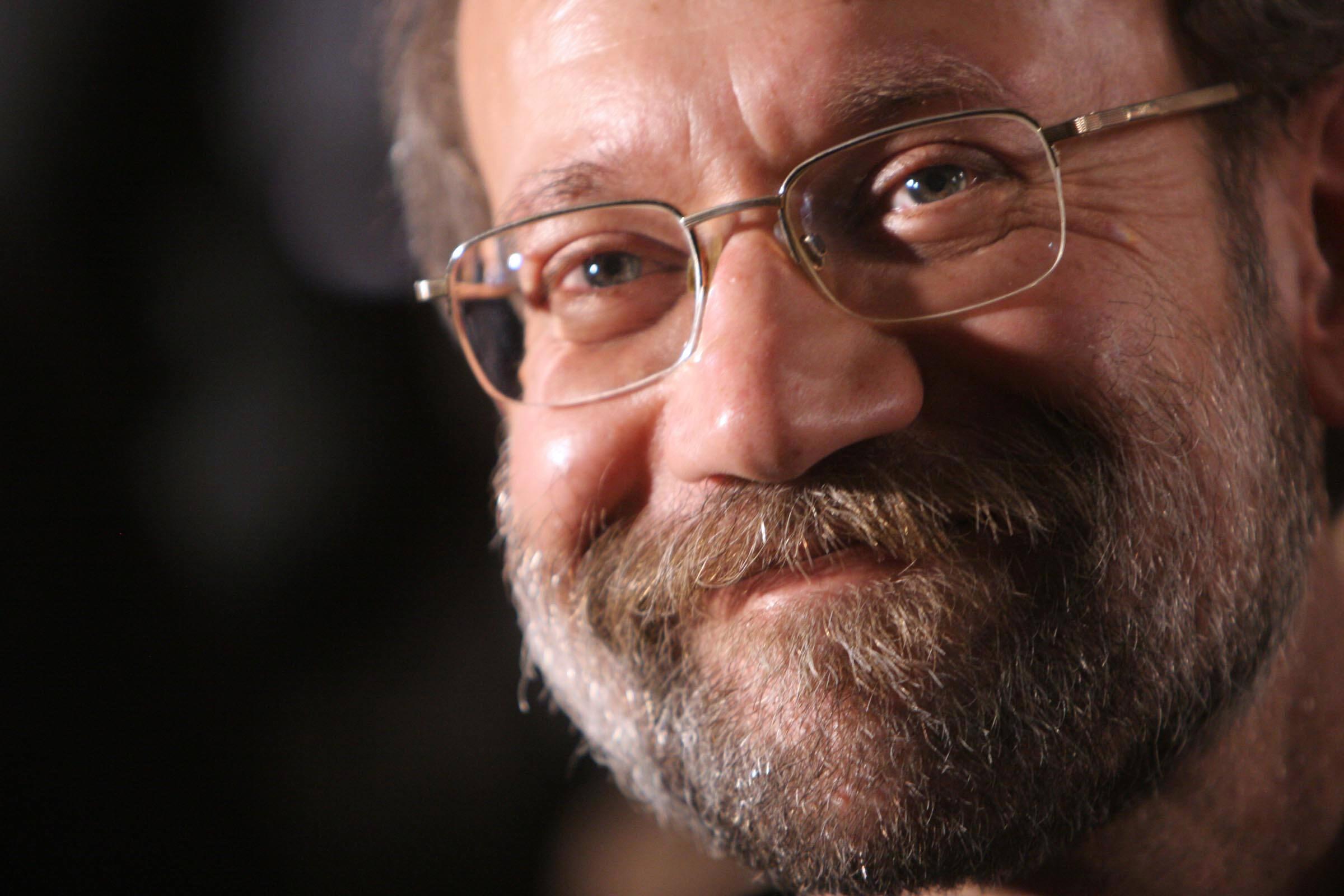 Iran's chief nuclear negotiator Ali Larijani smiles as he attends a ceremony in Natanz.