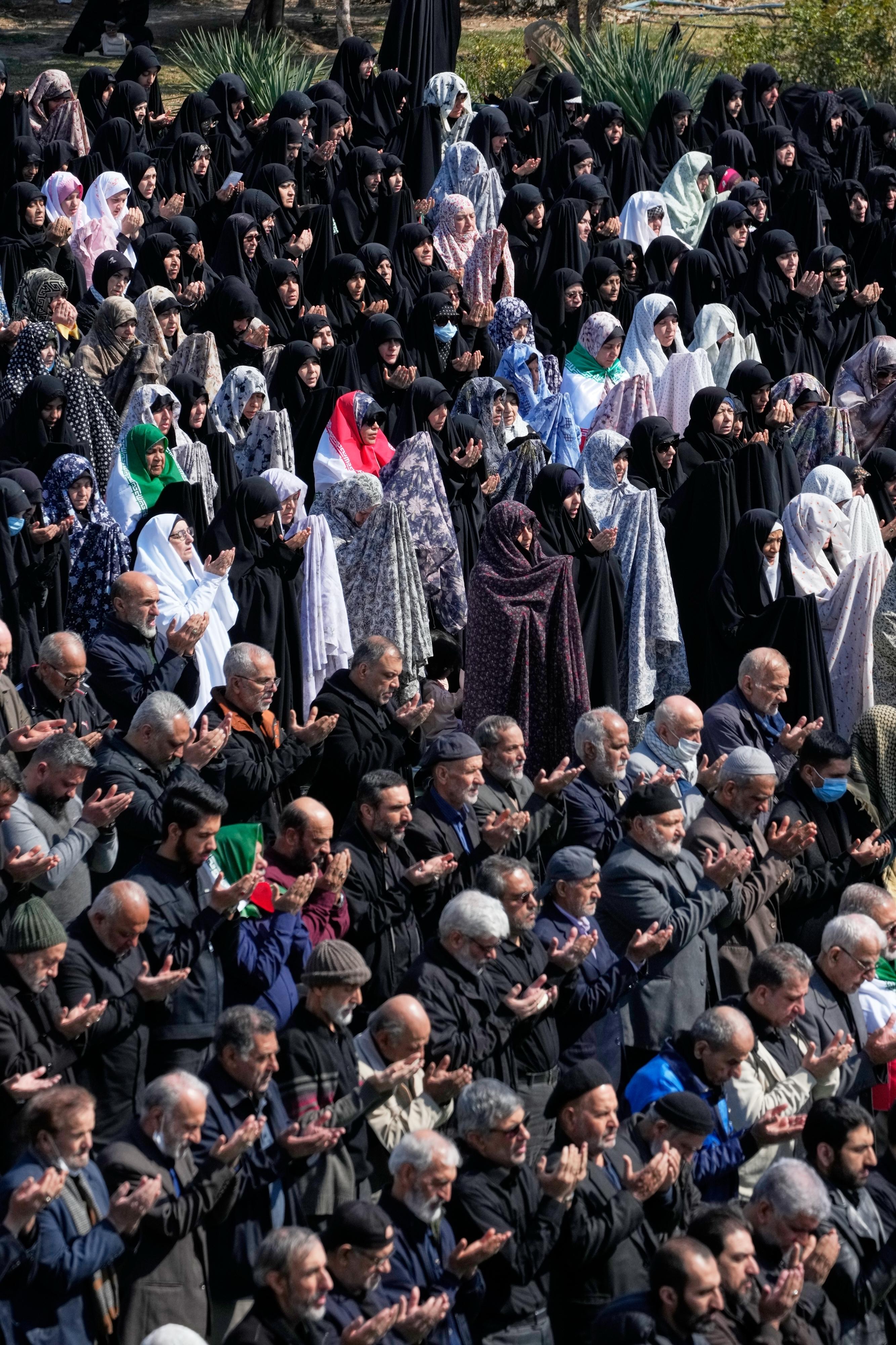 Iranians attend Friday prayers at the Imam Khomeini Grand mosque in Tehran.