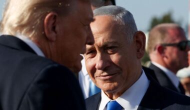 Israeli Prime Minister Benjamin Netanyahu looks on next to U.S. President Donald Trump as Trump leaves Israel en route to Sharm El-Sheikh, Egypt, to attend a world leaders' summit on ending the Gaza war, amid a U.S.-brokered prisoner-hostage swap and ceasefire deal between Israel and Hamas, at Ben Gurion International Airport in Lod, Israel, October 13, 2025. (Reuters/Evelyn Hockstein)