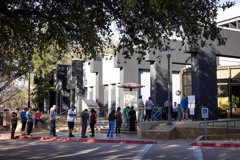 A line queues outside of the Irving City Hall polling center during Primary Election Day on...