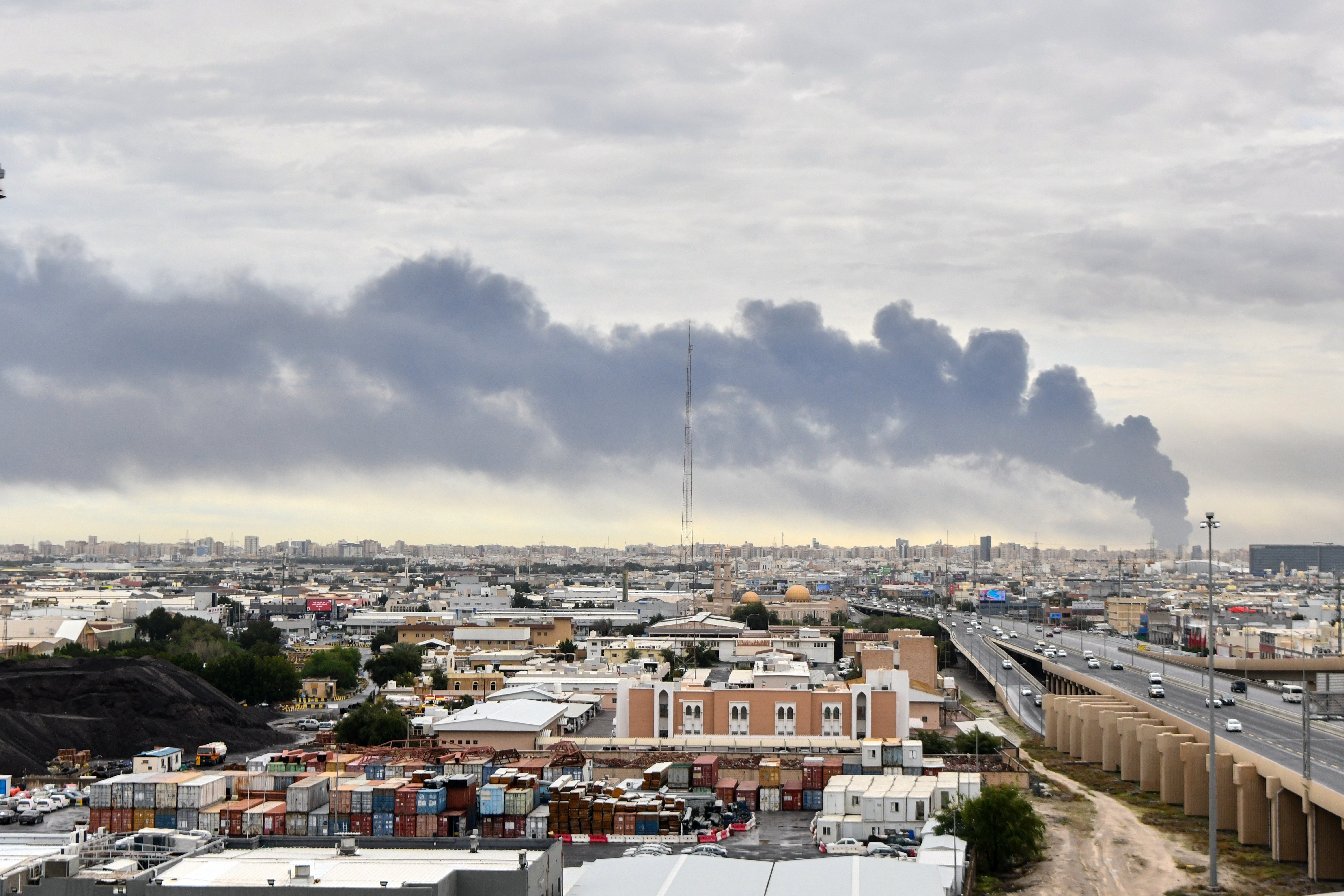 Smoke rises from Kuwait international airport after a drone strike on fuel storage in Kuwait City
