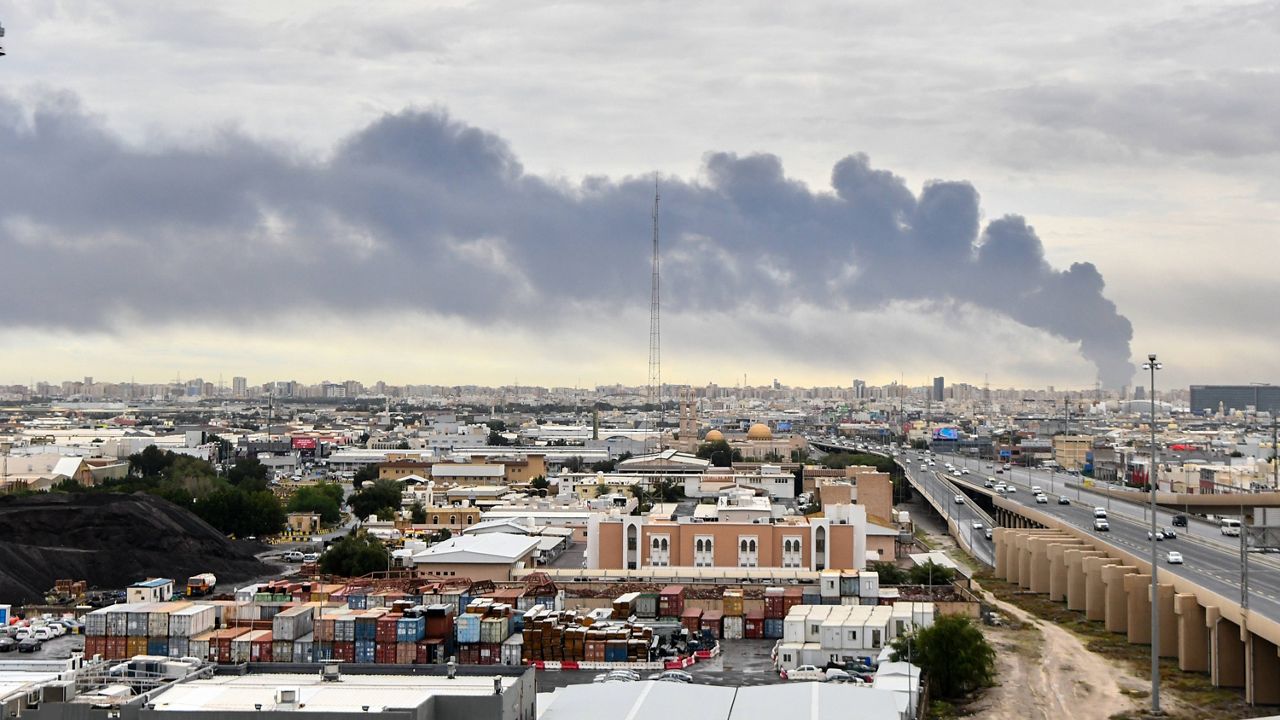 Smoke rises from Kuwait international airport after a drone strike on fuel storage in Kuwait City, Kuwait, Friday, Wednesday, March 25, 2026. (AP Photo)