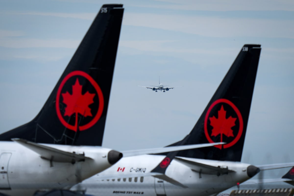Canadian airlines hit by soaring jet fuel costs balance hedging and increasing ticket prices