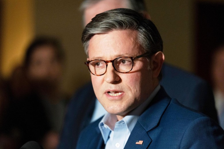 A closeup of Mike Johnson speaking at an event