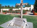 FILE - This Oct. 2, 2012, file photo shows the grave of Chicano farmworker leader Cesar Chavez in the memorial garden at La Paz, the United Farm Workers of America headquarters, now the Cesar E. Chávez National Monument, in Keene, Calif.