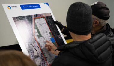 Residents look at a map showing a proposed data centre in Olds, Alberta.