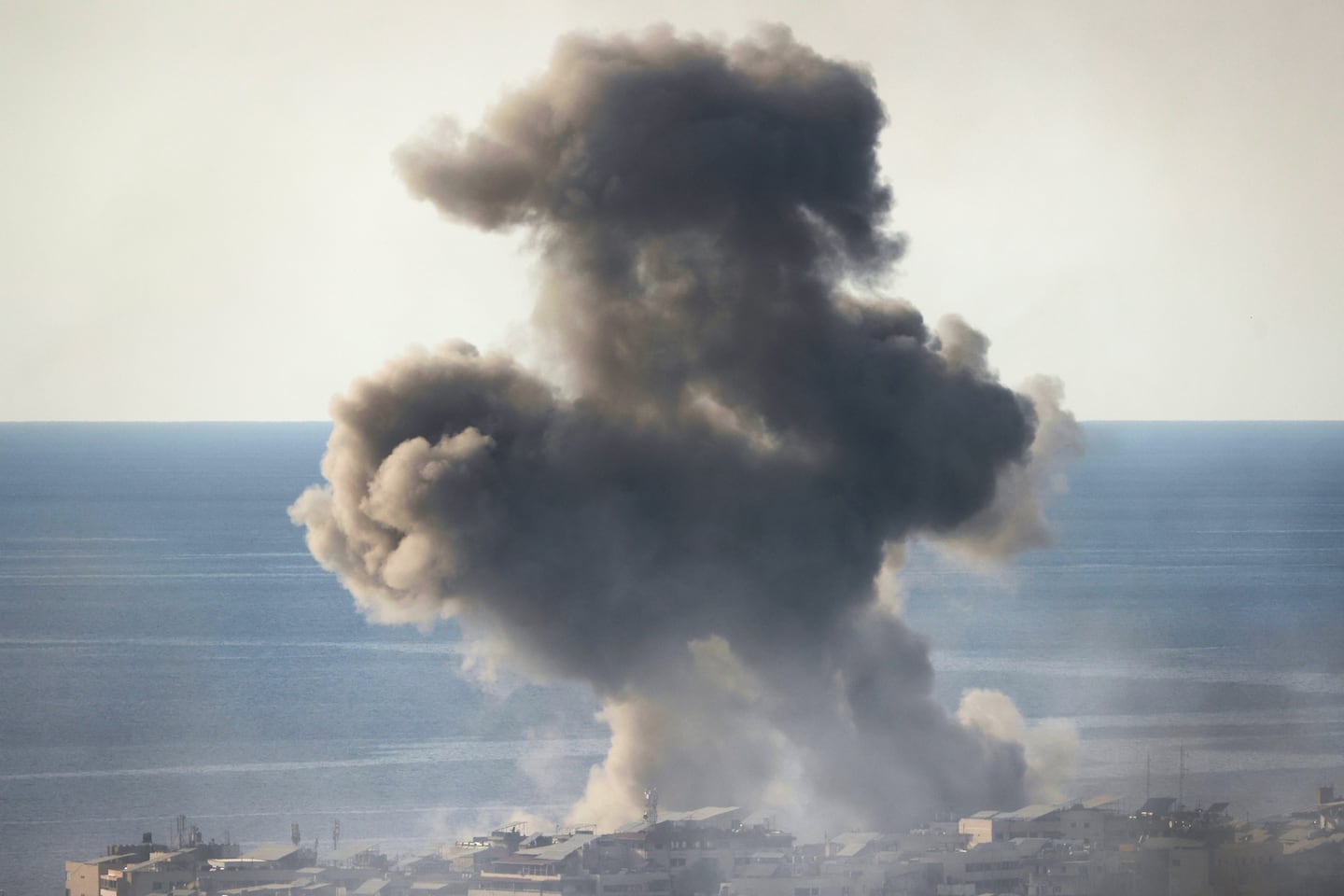 Smoke rises from the site of an Israeli airstrike in Beirut's southern suburbs on March 6, 2026. Fresh strikes rocked Iran and Lebanon on March 6, as Israel vowed to escalate to a new phase in the Middle East war that has spiralled rapidly throughout the region and beyond.