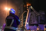 Emergency personnel work to extinguish a fire in a building after an Iranian strike in the capital Manama on February 28, 2026. The United States and Israel launched waves of strikes on February 28 against targets in Iran, sparking swift retaliation by the Islamic republic which responded with missile attacks across the region.