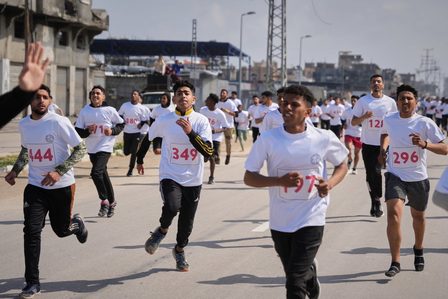 Runners take part in the 4-kilometer Zayed Marathon, sponsored by the United Arab Emirates, along Salah al-Din Street in the central Gaza Strip, Friday, March 27, 2026. 