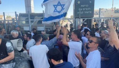 Right-wing protesters wave Israeli flags outside Sde Teiman detention facility, after Israeli Military Police arrived at the site as part of an investigation into suspected abuse of a Palestinian detainee, near Beersheba in southern Israel, July 29, 2024. (Reuters File)