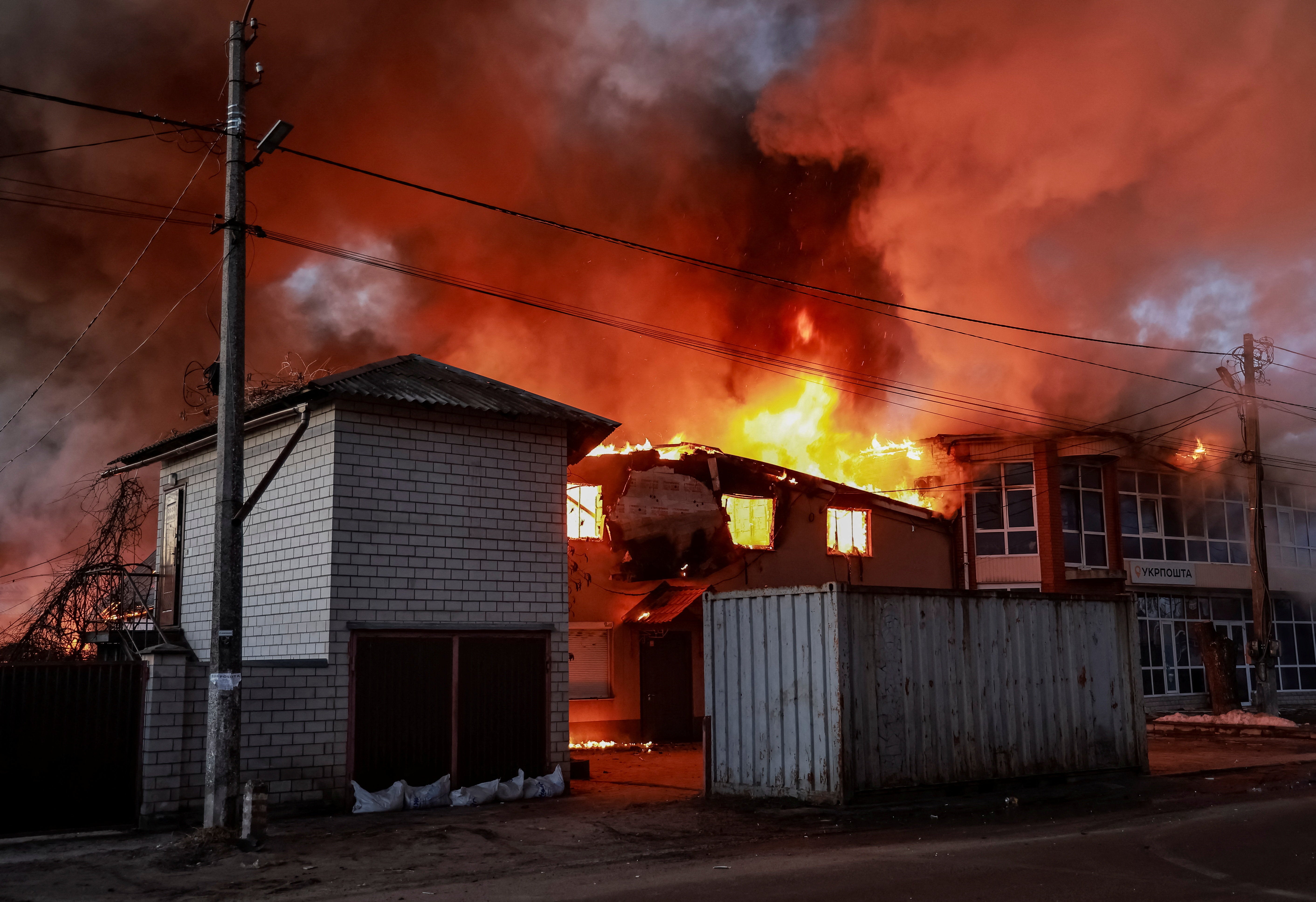 Fire and smoke rise at the site of a Russian missile and drone strike, amid Russia's attack on Ukraine, in the town of Brovary, in Kyiv region