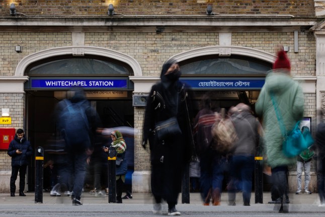 LONDON, ENGLAND - FEBRUARY 12: Members of the public outside Whitechapel Underground Station on February 12, 2025 in London, England. Bengali signage was installed at the station in 2022, funded by Tower Hamlets council amid wider station improvements, to recognise the contribution of the Bangladeshi community in Tower Hamlets and London generally. In February 2025, Reform UK MP for Great Yarmouth, Rupert Lowe, criticised the sign in a post on X, saying that