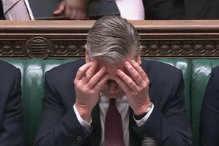 Keir Starmer speaking at Prime Ministers Questions in the UK Parliament, addressing key issues with government officials.