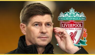 Steven Gerrard puts his hand to his ear next to Liverpool club badge.