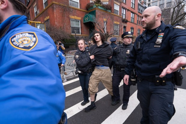 A man is arrested after throwing a hand-made smoke device at right-wing activist Jake Lang and his supporters on Saturday, March 7, 2026, in Manhattan, New York. (Barry Williams/ New York Daily News)
