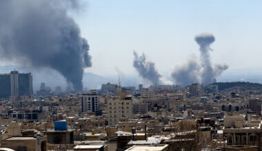 Plumes of smoke rise following reported explosions in Tehran.