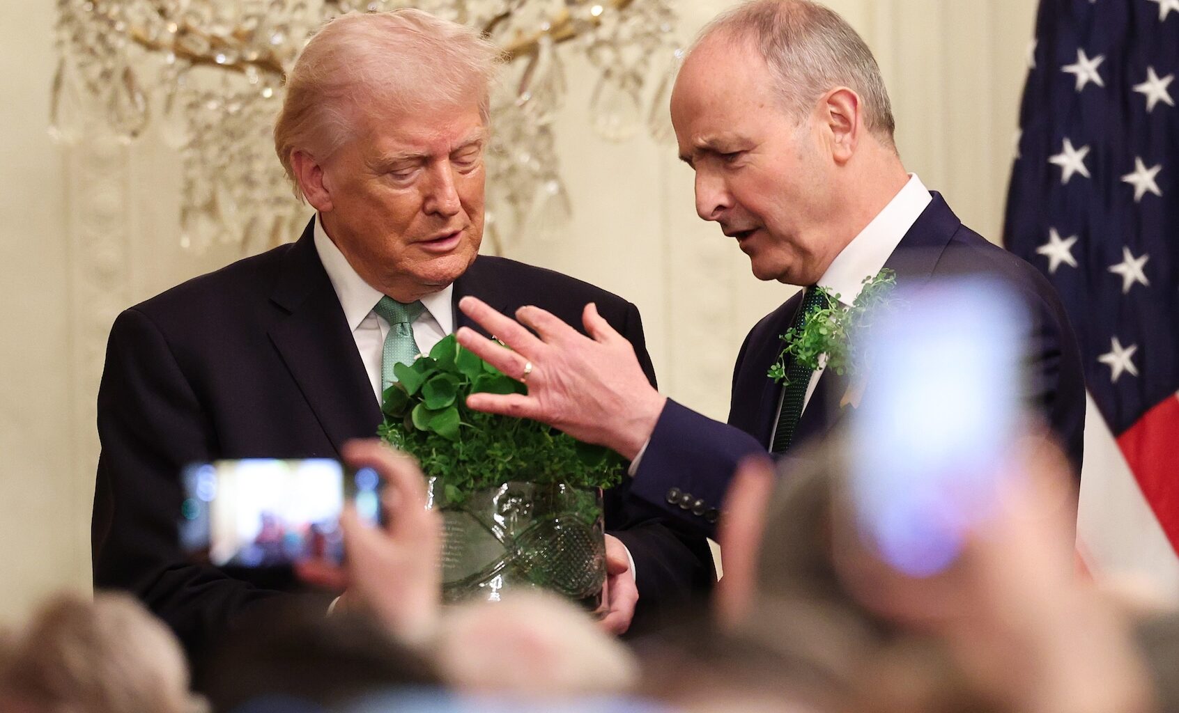 President Donald Trump receives the traditional bowl of shamrock from Taoiseach of Ireland Micheál Martin in the East Room of the White House, March 17, 2026. (Win McNamee/Getty Images)