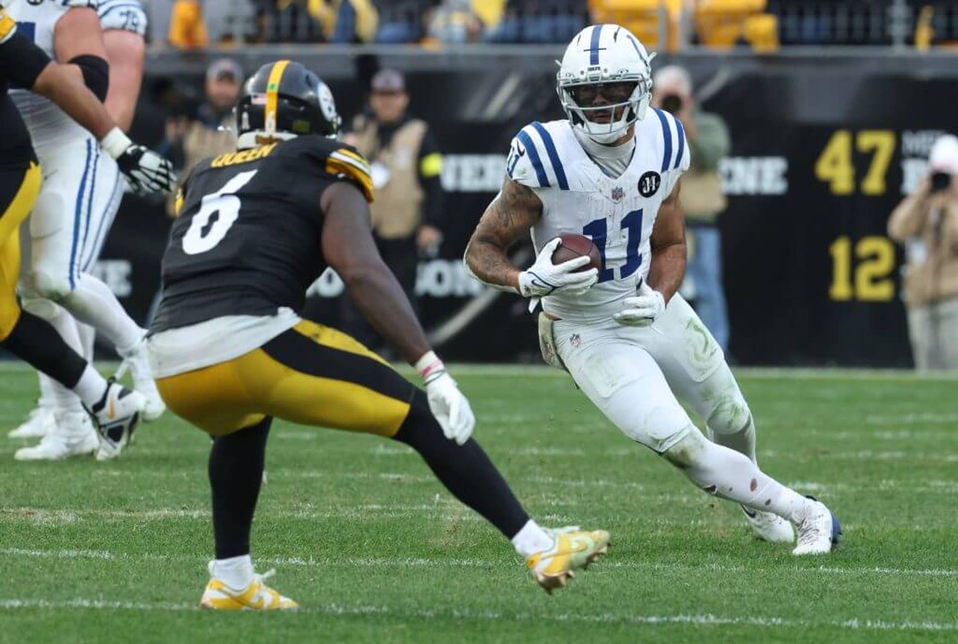 Indianapolis Colts wide receiver Michael Pittman runs after a catch as Pittsburgh Steelers linebacker Patrick Queen defends during the fourth quarter at Acrisure Stadium in Pittsburgh.