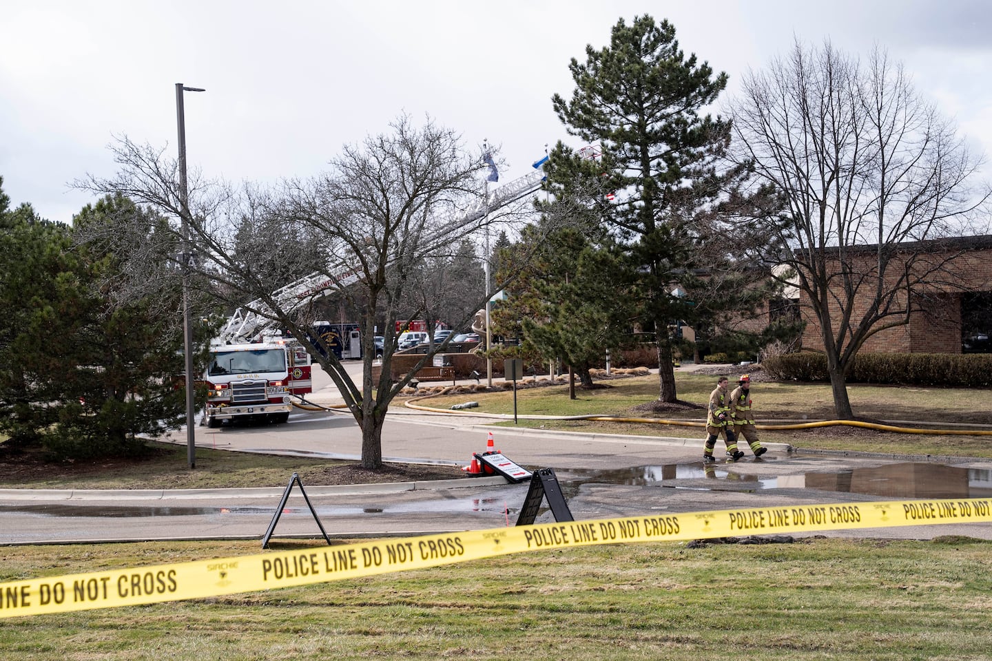 Police officers and firefighters at the scene where a truck was rammed into Temple Israel, a synagogue in West Bloomfield Township, Mich., March 12, 2026.