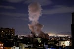 A smoke plume rises following a missile strike on a building in Tehran on March 1, 2026. The United States and Israel launched strikes against Iran on February 28, killing Iran's supreme leader and top military leaders, prompting authorities to retaliate with strikes on Israel and US bases across the Gulf.