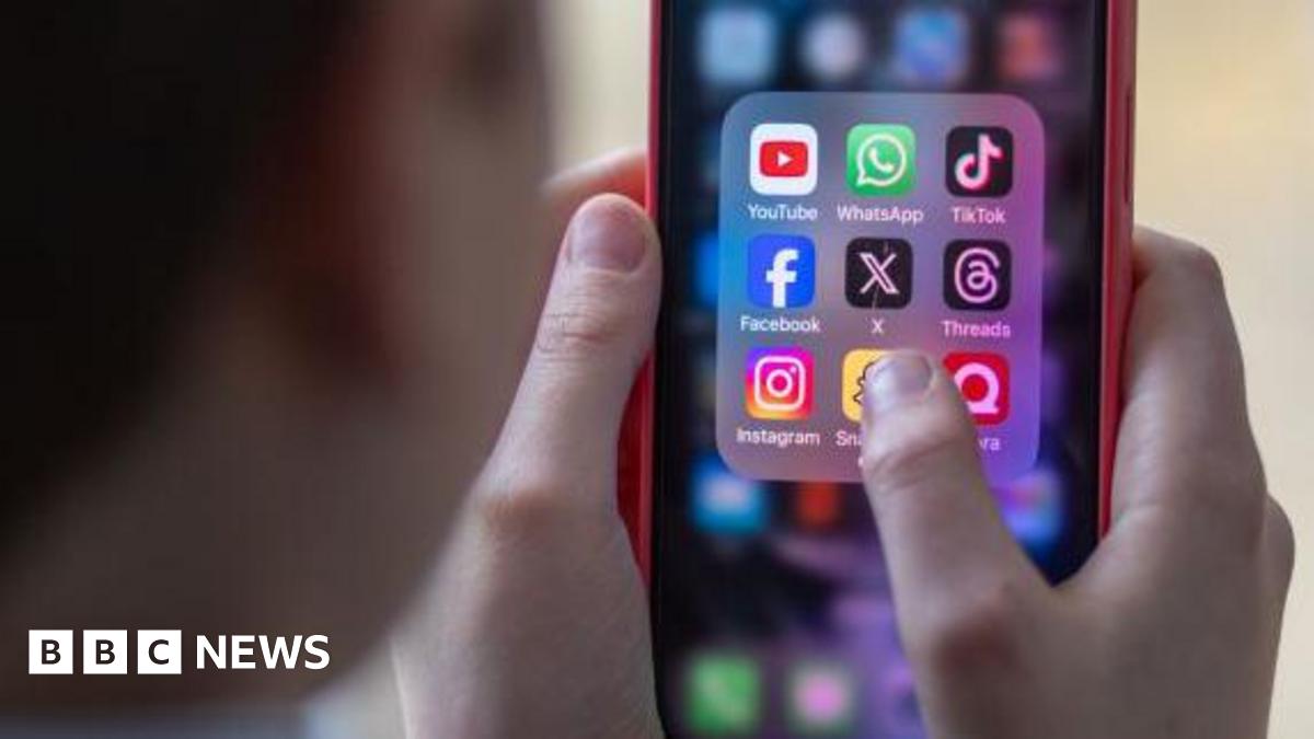 Generic image of a school child using a smartphone to look at social media