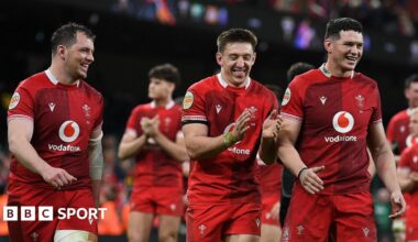 Wales players Ryan Elias, Josh Adams and James Botham celebrate after beating Italy