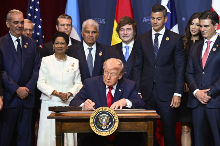 US President Donald Trump signs a proclamation at the "Shield of the Americas" Summit at Trump National Doral in Miami, Florida, March 7, 2026.