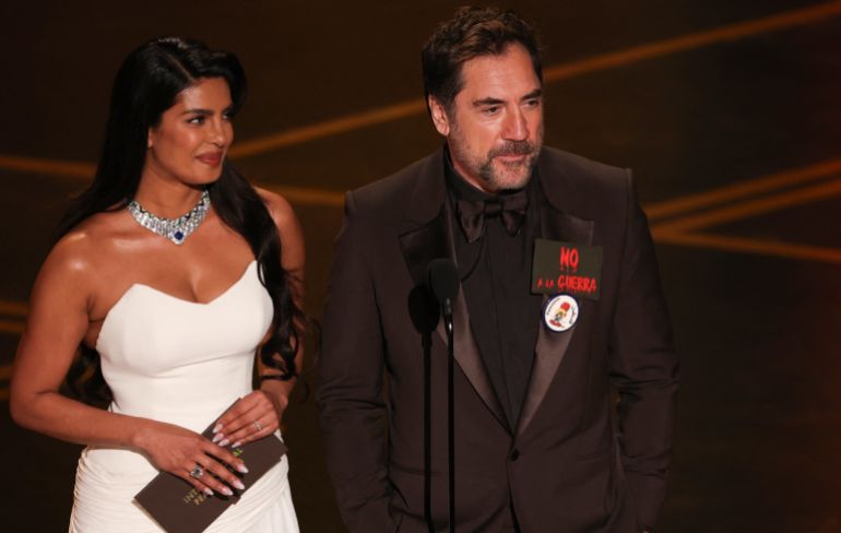 Indian actress Priyanka Chopra and Spanish actor Javier Bardem present the award for Best International Feature Film onstage during the 98th Annual Academy Awards at the Dolby Theatre in Hollywood, California on March 15, 2026. (Photo by Patrick T. Fallon / AFP)