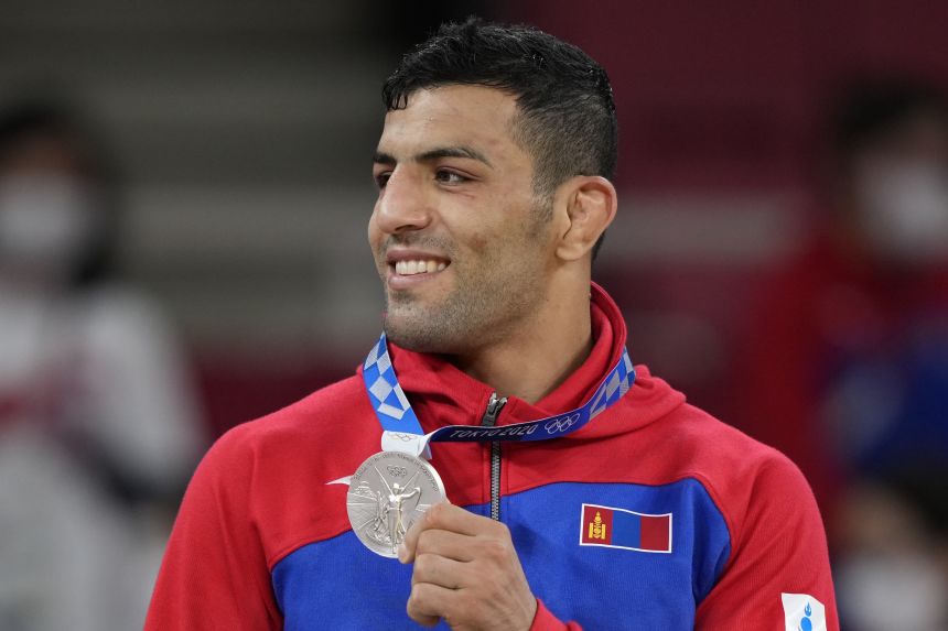 Mollaei celebrates with his silver medal during the award ceremony for the men -81kg judo match at the 2020 Summer Olympics in Tokyo, Japan, on July 27, 2021.