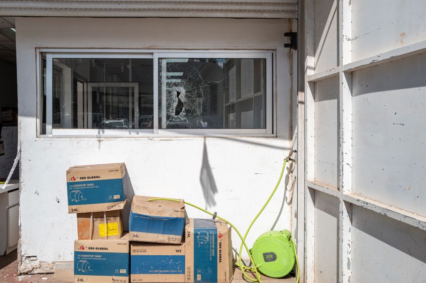 A window is seen damaged following a missile carrying a cluster munition warhead, in Yehud, Israel, on March 10.