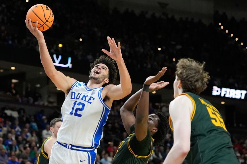 Duke forward Cameron Boozer is fouled during the first half against Siena.
