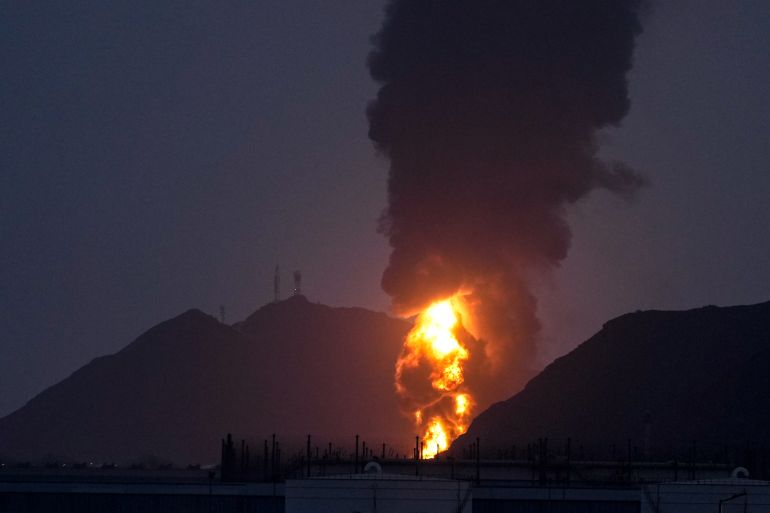 Large fire and plume of smoke is visible after, according to the authorities, debris of an Iranian intercepted drone hit the Fujairah oil facility, in Fujairah, United Arab Emirates, Tuesday, March 3, 2026. (AP Photo/Altaf Qadri)