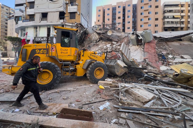 Civil Defense workers remove the rubbles of a destroyed building that was hit by an Israeli airstrike in Dahiyeh, Beirut's southern suburbs, Lebanon, Tuesday, March 24, 2026. (AP Photo/Hussein Malla)