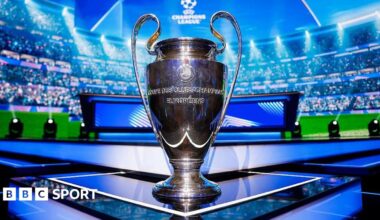 The UEFA Champions League trophy is seen on the stage ahead of the League Phase draw