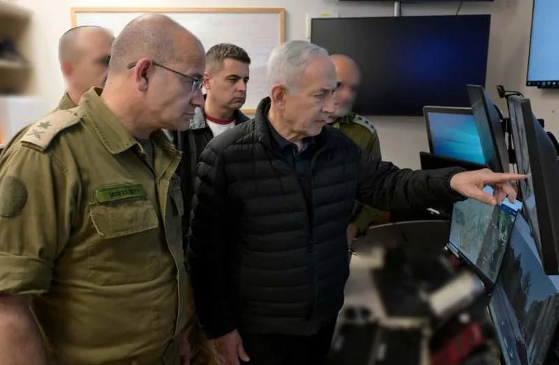 Prime Minister Benjamin Netanyahu receiving an update on the missile strike in Arad, March 21, 2026. (credit: Avi Ohayon/GPO)