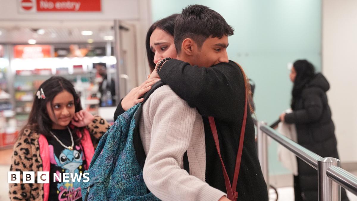 Ahmad, 12, is greeted by his mum, Hafsa, after arriving at Terminal 3 of London Heathrow Airport from Pakistan via Dubai, where he spent three nights alone in Dubai airport, looked after by Emirates staff.