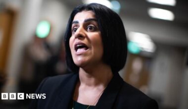 Shabana Mahmood is dressed in a black jacket and inside an office.