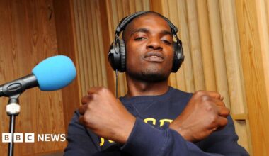 Dot Rotten crosses his arms across his chest while recording a session at the BBC's Maida Vale Studios in 2011