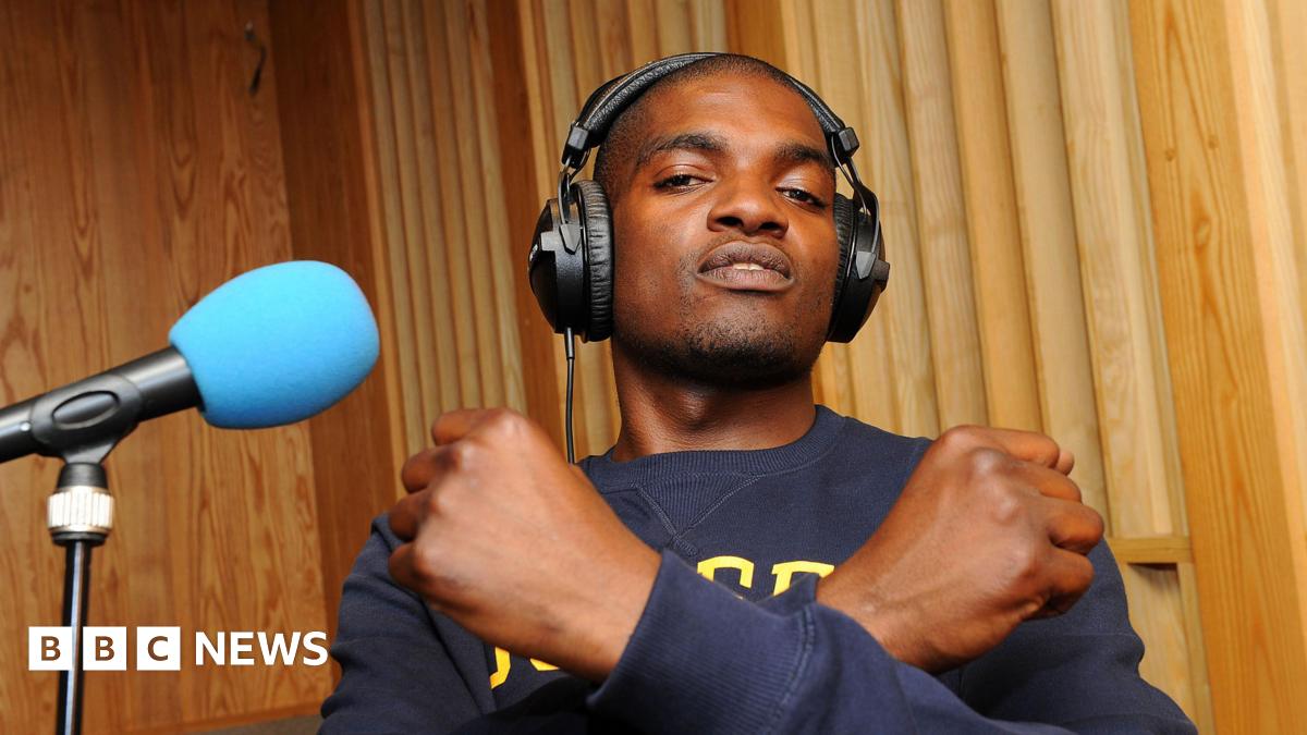 Dot Rotten crosses his arms across his chest while recording a session at the BBC's Maida Vale Studios in 2011