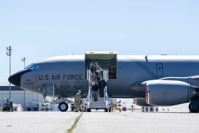 Retired Master Sgt. Eugene T. Beal and his family exits a KC-135 Stratotanker April 3, 2023, at Beale Air Force Base, California. Eugene visited Beale days before his 90th birthday to reunite with the airframe he flew in during his career as a boom operator. (U.S. Air Force photo by Staff Sgt. Ramon A. Adelan)