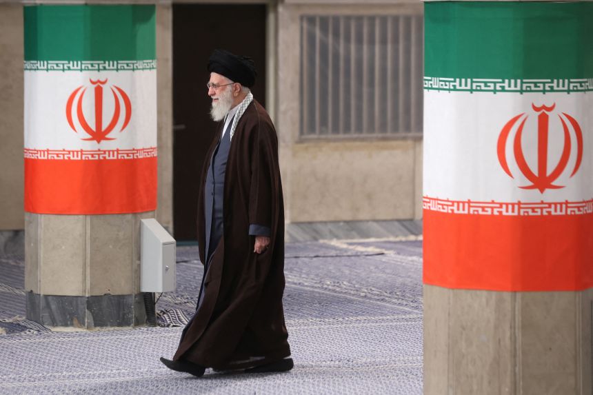 Iran's Supreme Leader Ayatollah Ali Khamenei arrives to cast his vote during parliamentary elections in Tehran, Iran, on March 1, 2024.