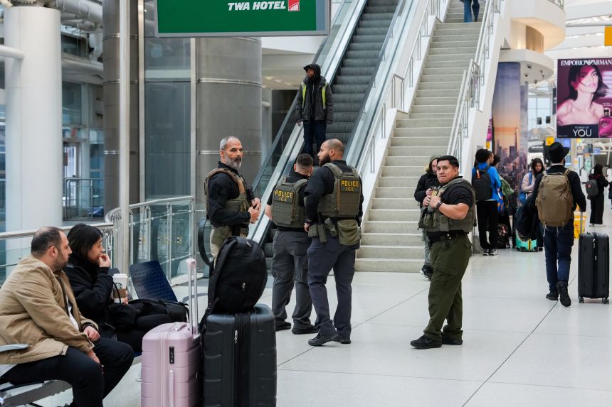 Immigration and Customs Enforcement agents patrol at John F. Kennedy International Airport in New York on Monday.