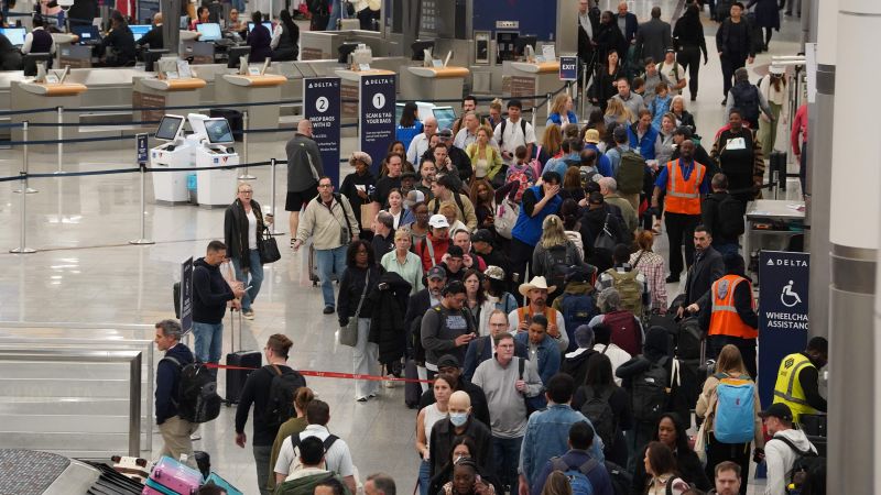 Travelers face unpredictable airport wait times as TSA officers go unpaid - CNN