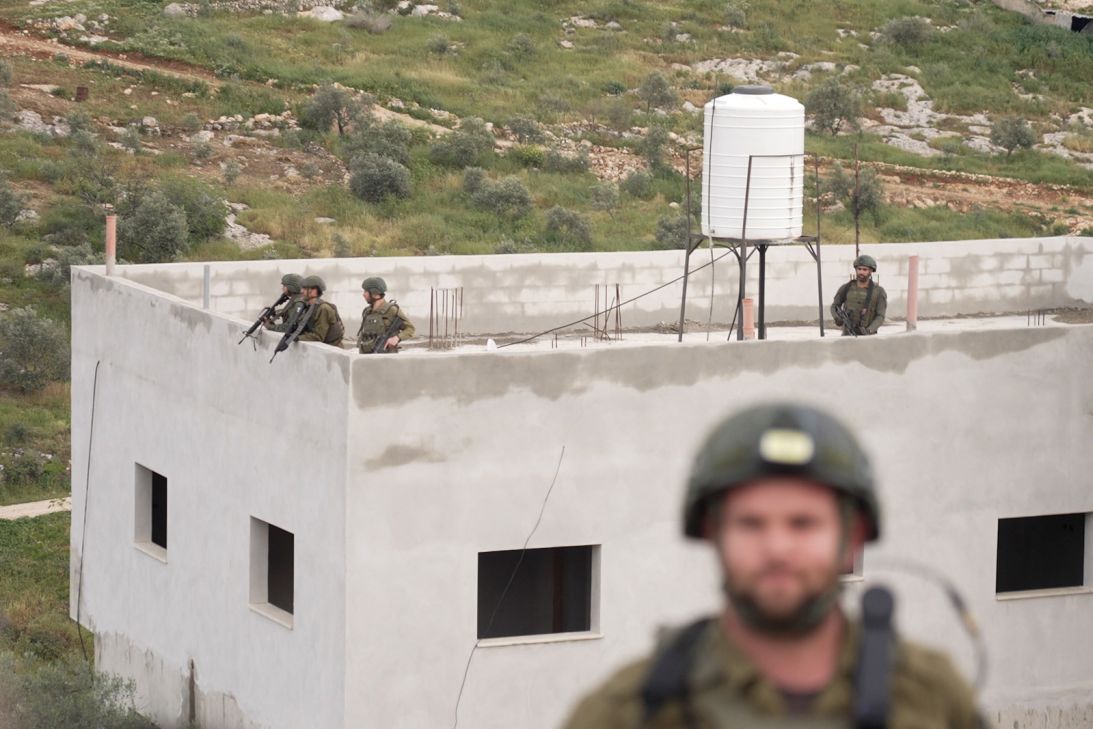 Israeli soldiers at a Palestinian home in the West Bank.