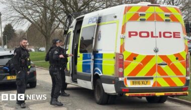 Leicestershire police armed officers at the door of a police van at Aylestone Road in Leicester.