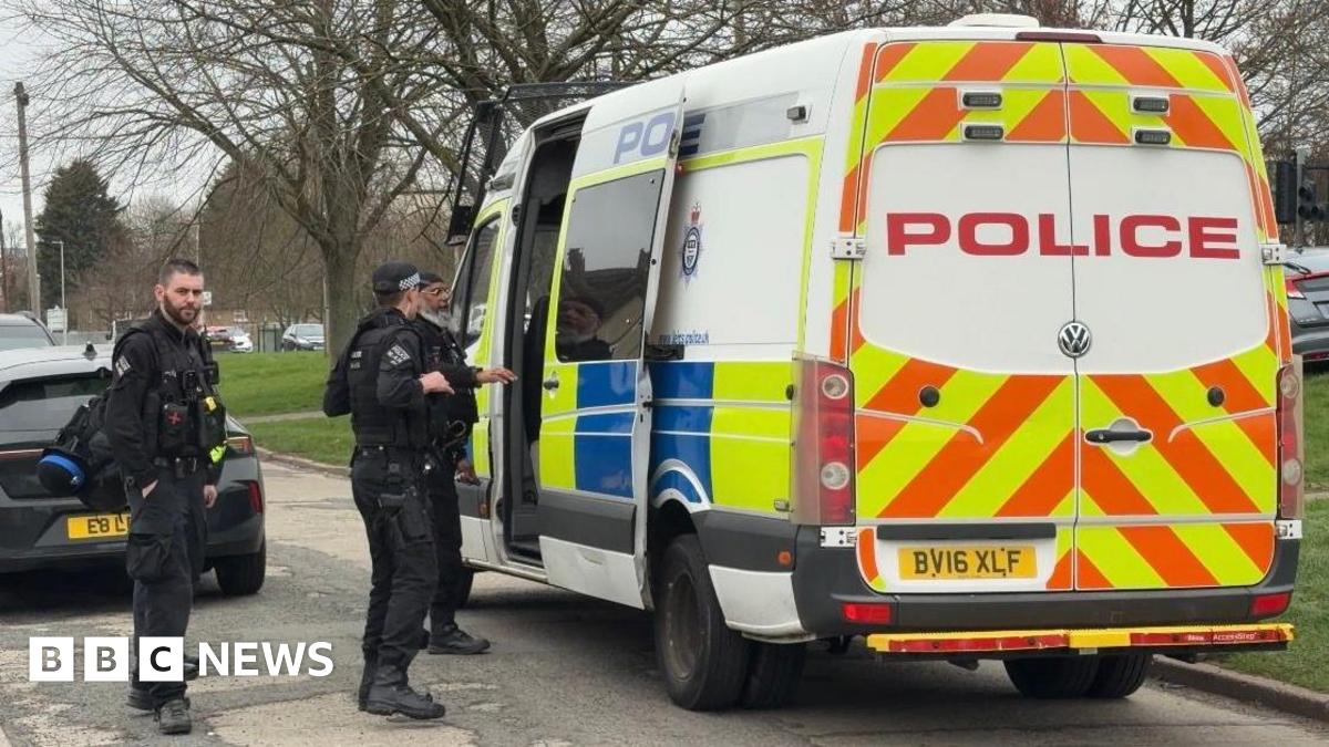 Leicestershire police armed officers at the door of a police van at Aylestone Road in Leicester.