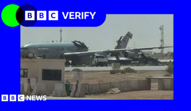 a large grey aircraft with US Air Force markings is shown with a large part of its middle section missing and its tail at an angle.