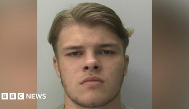 Sonny Boyes looking into the camera. He has brown eyes and hair.