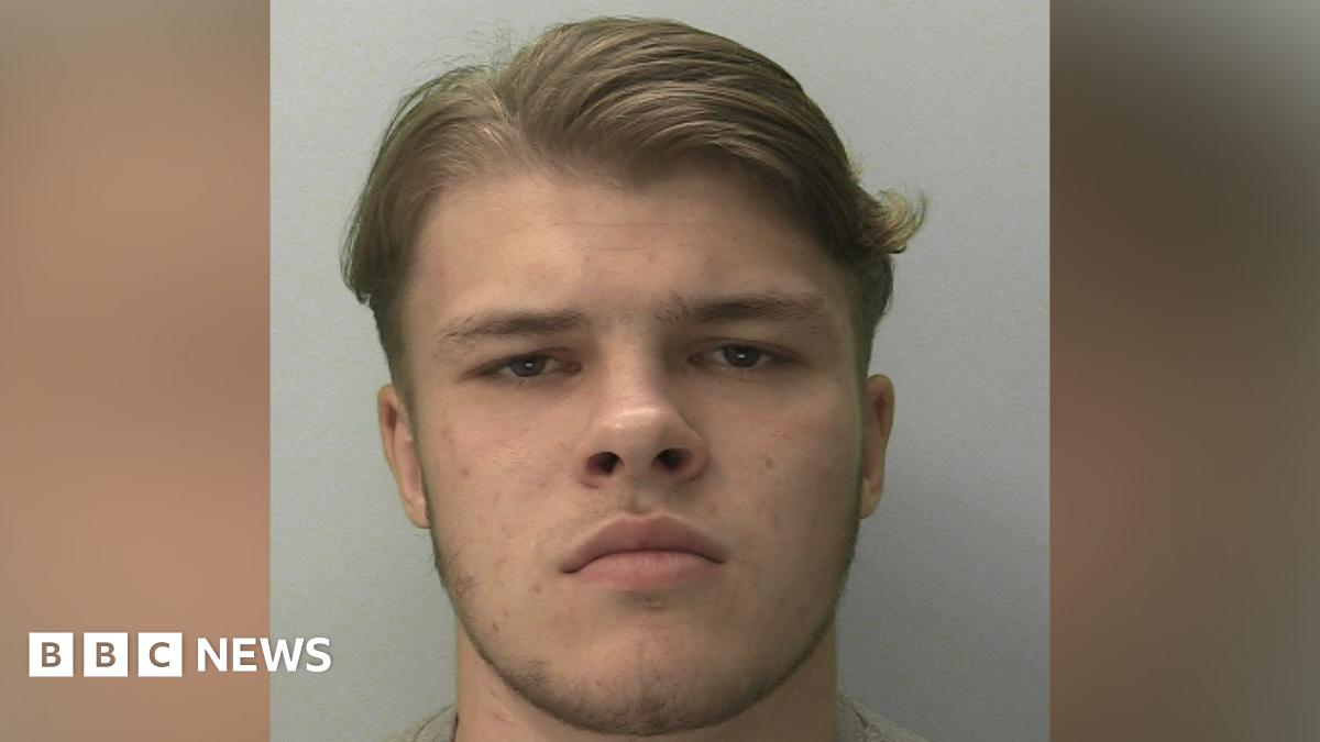 Sonny Boyes looking into the camera. He has brown eyes and hair.